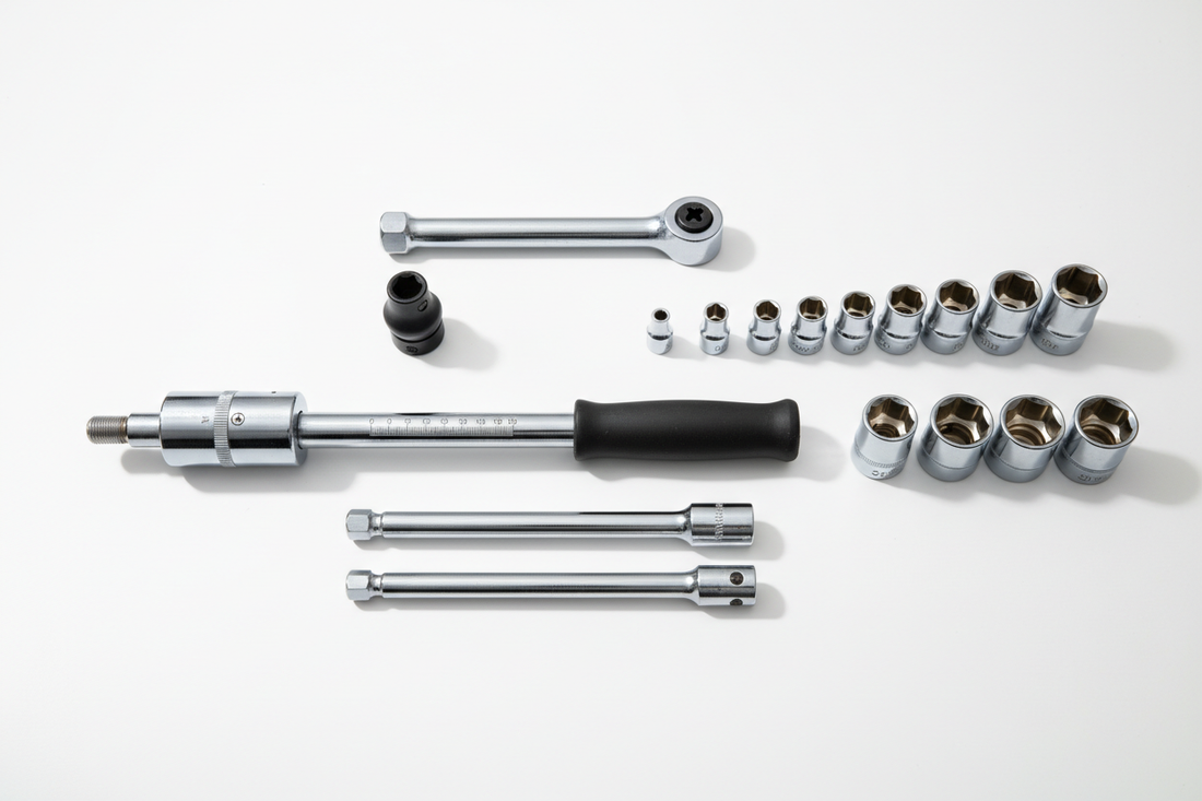 Torque wrench set flat lay — click torque wrench, sockets, and extension bars on white surface