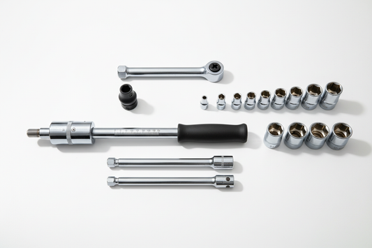 Torque wrench set flat lay — click torque wrench, sockets, and extension bars on white surface