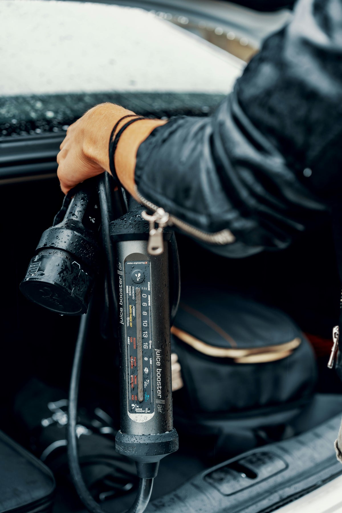 Portable tire inflator pumping air into a car tire