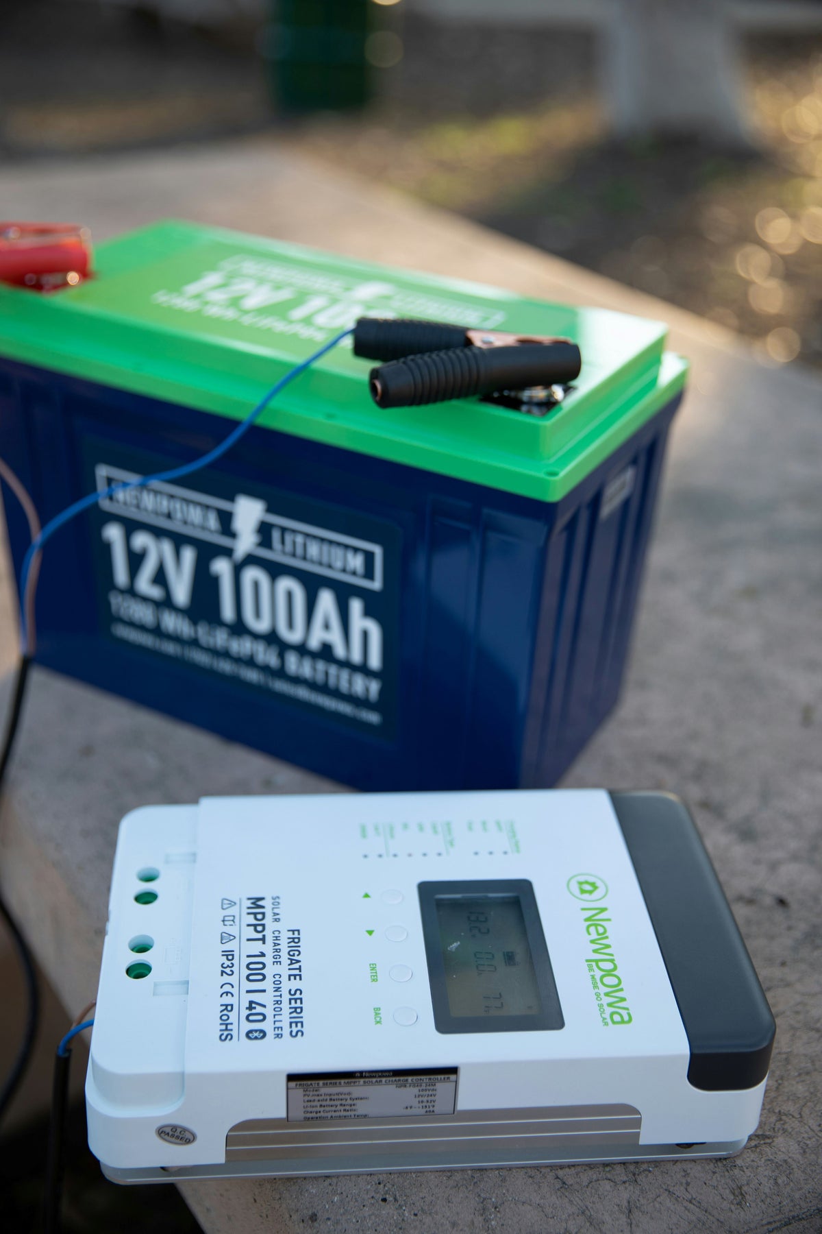 Battery charger connected to a car battery for charging