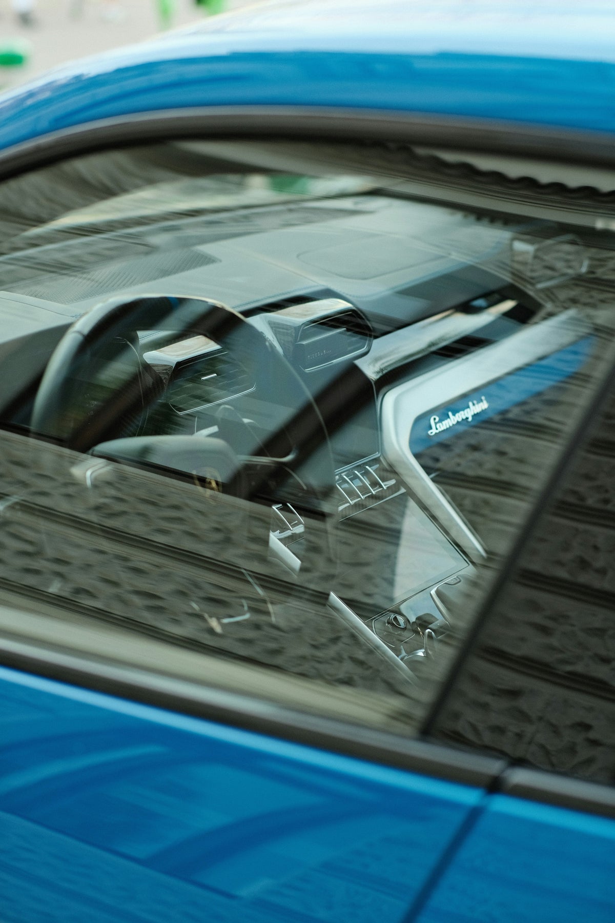Cleaning car window with glass cleaner for clear visibility