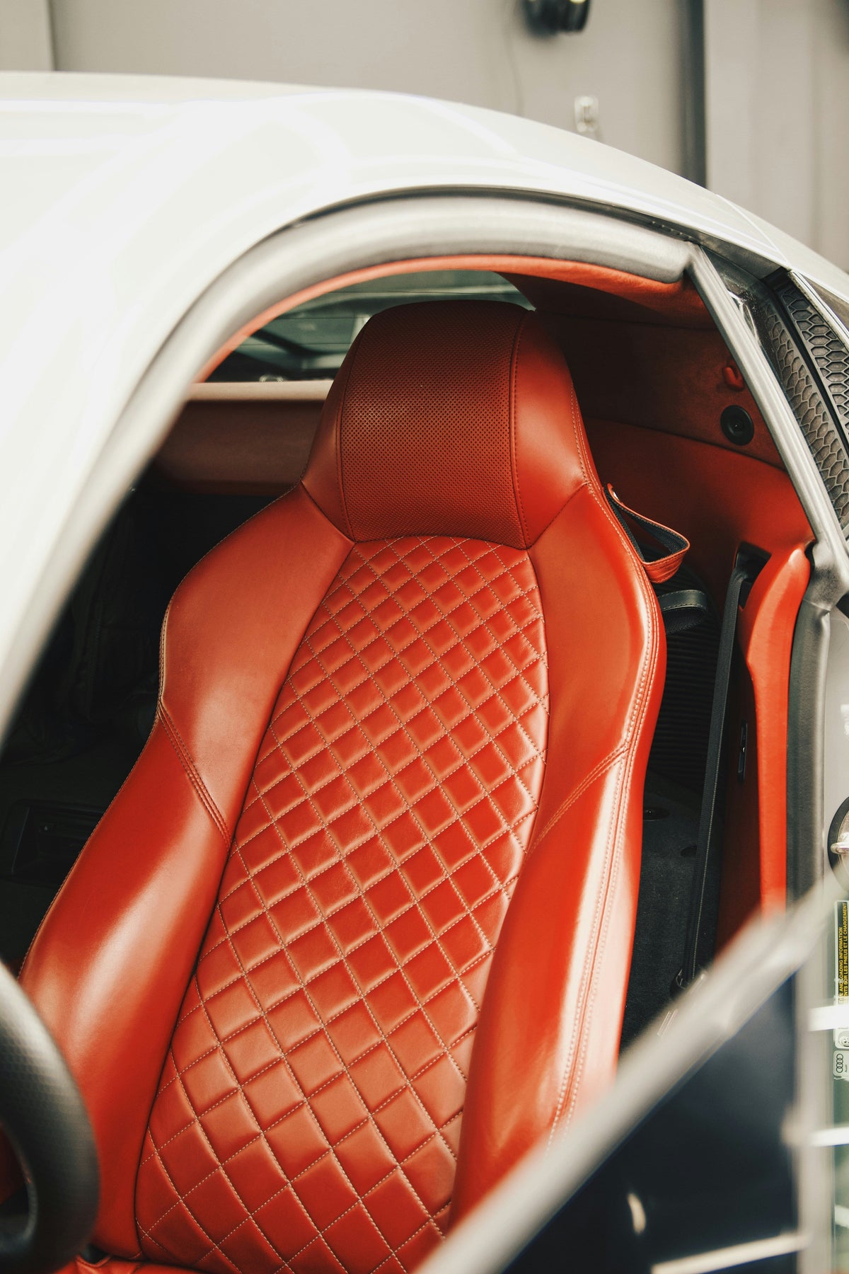 Cleaning and conditioning leather car seats with leather care product